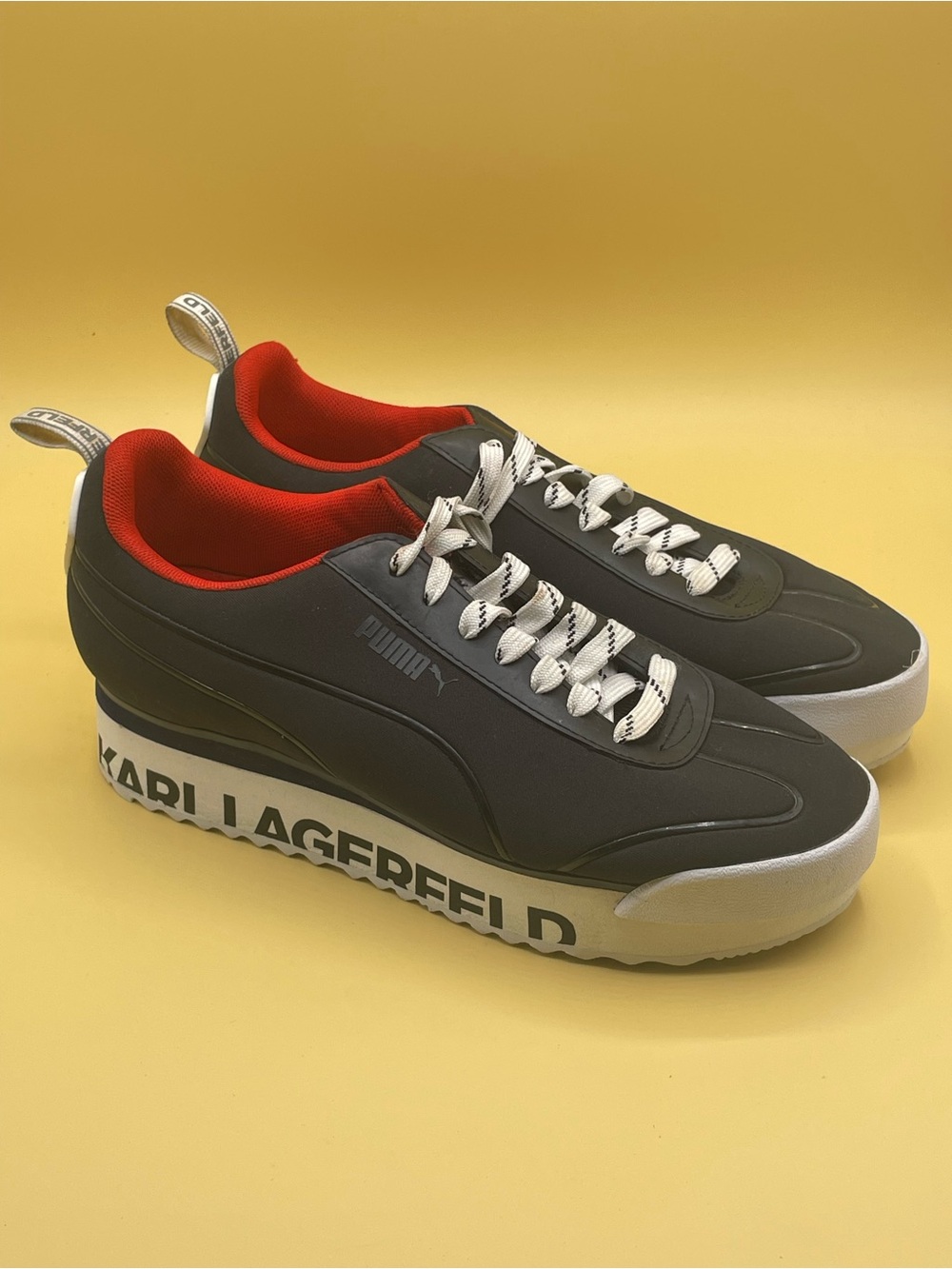Puma x Karl Lagerfeld Roma Amor platform sneakers in black and red.